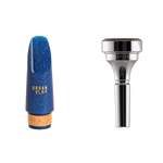 Image of a clarinet mouthpiece and cornet mouthpiece, suitable for students.