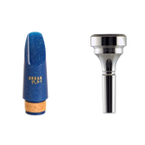 Image of a clarinet mouthpiece and cornet mouthpiece, suitable for students.